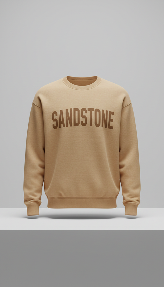 Sandstone bold typography sweatshirt, Single-product focus: hero garment displayed on matte plinth or hanger against...