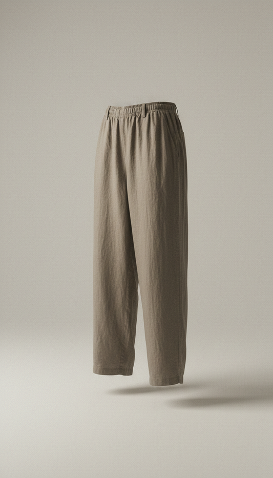 Showcase Luxe Comfort linen pants in a relaxed fit, centered on a neutral-toned background with soft, creating a subtle...